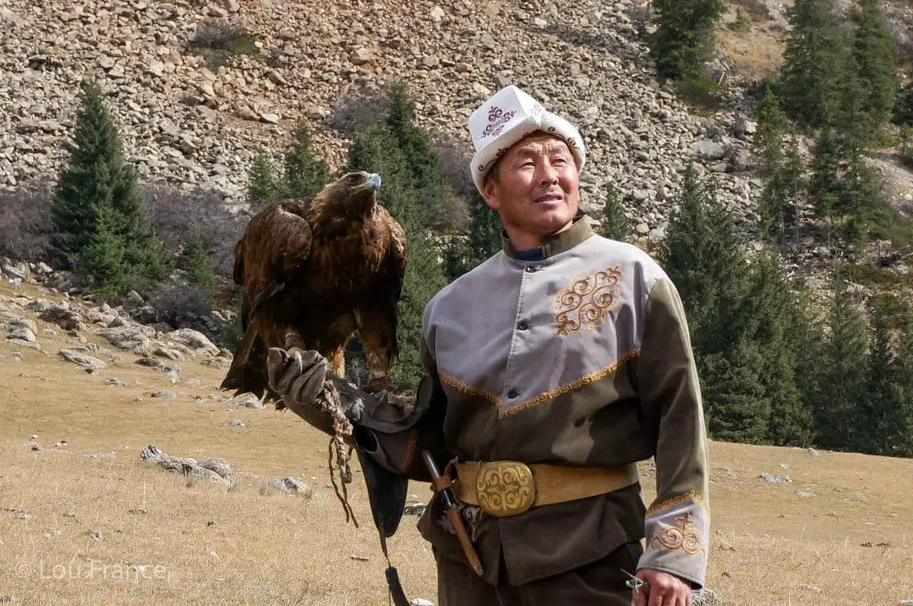 An Eagle Hunter with his Eagle. Seeing the Nomadic culture is a great reason to visit Kyrgyzstan