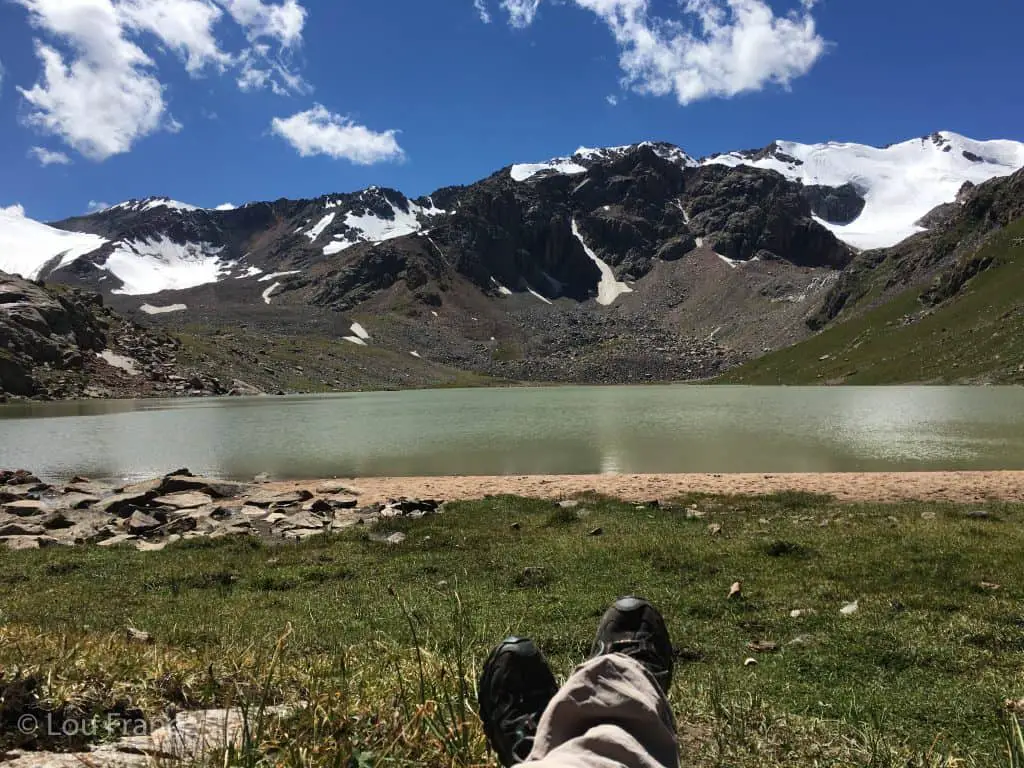 Putting my feet up next to a lake on a recent trip to Kyrgyzstan